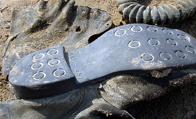 The sole of a soldier's boot on the shore...